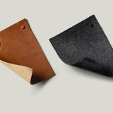 Brown leather and grey wool swatches.