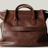 Brown leather bag on a light gray background