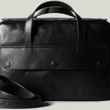 Black leather briefcase on a light gray background