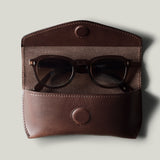 Dark brown leather glasses case with sunglasses