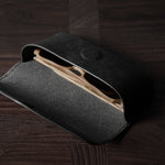 Black leather glasses case with sunglasses