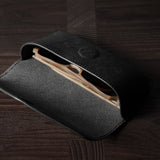 Black leather glasses case with sunglasses