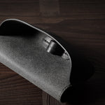 Black leather glasses case showing inside