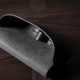 Black leather glasses case showing inside