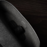 Black leather glasses case showing inside