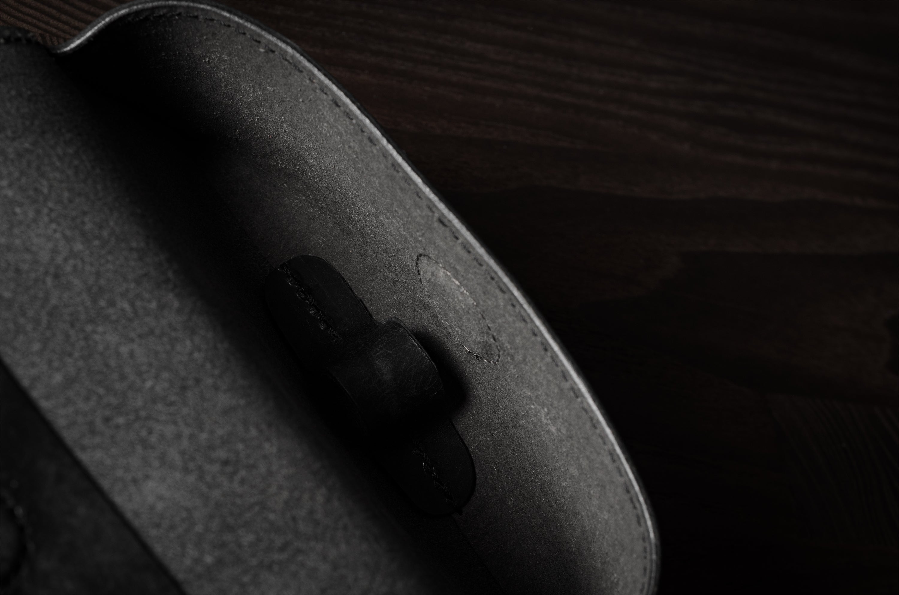 Black leather glasses case showing inside