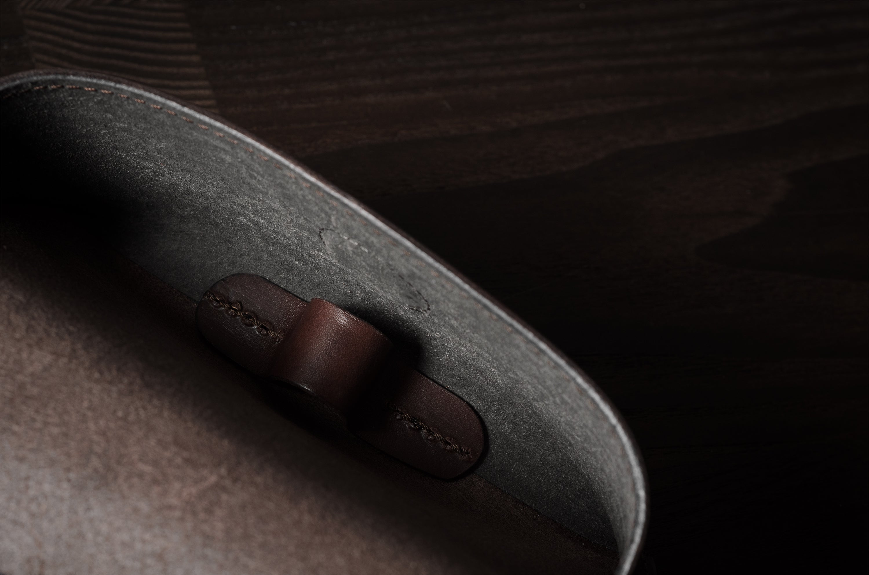 Dark brown leather glasses case showing inside