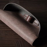Dark brown leather glasses case showing inside