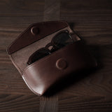 Dark brown leather glasses case with sunglasses