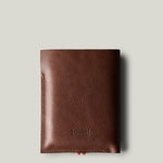 A brown leather iPhone Duo with a pebbled texture, shown vertically against a light gray background.