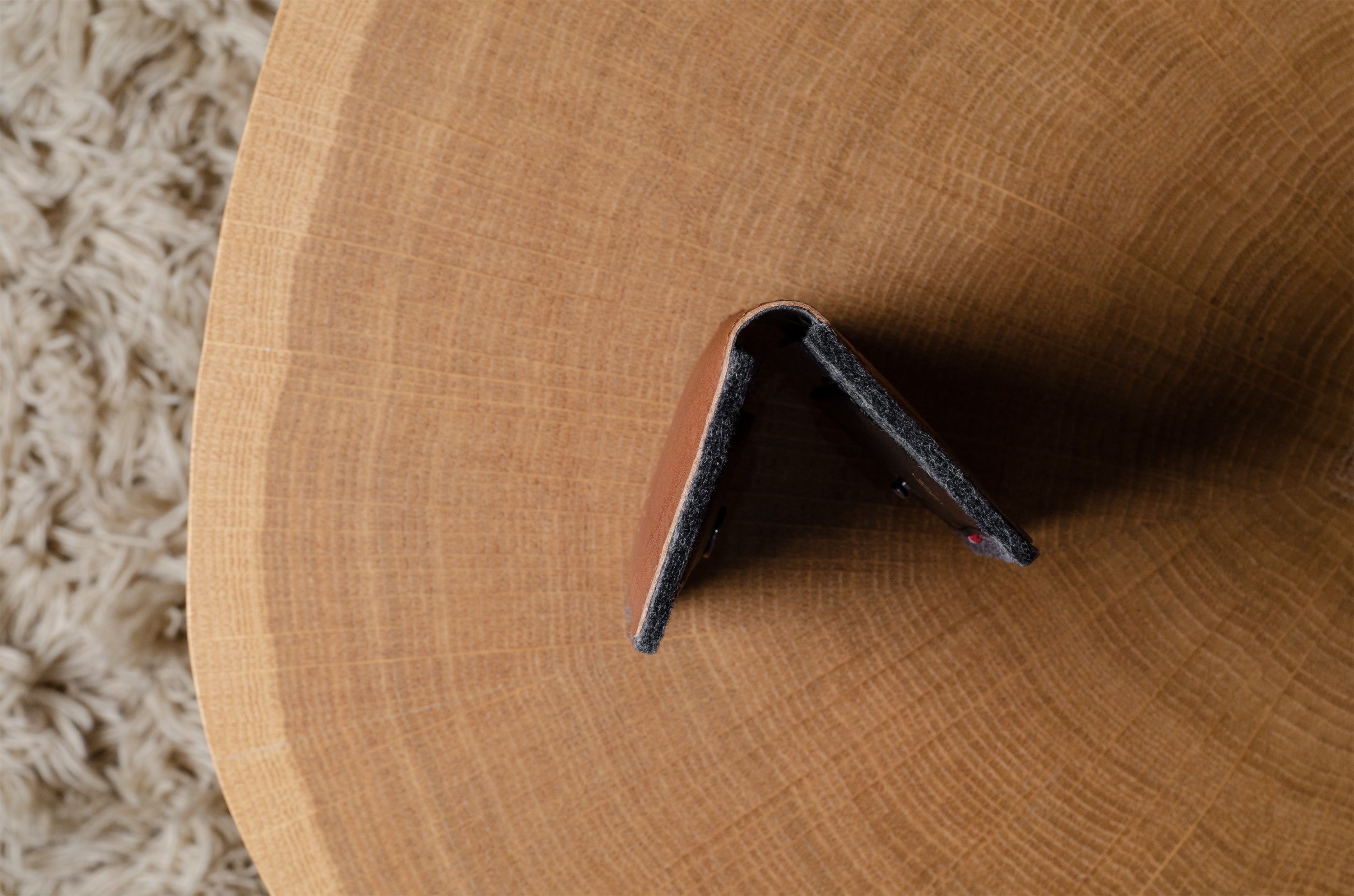 Close-up of a wallet on a wood background