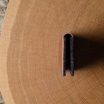 Close-up of a wooden surface with a wallet on it