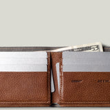 Brown leather wallet with card slots and money pocket on a light gray background