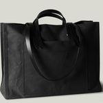 Black canvas bag with leather straps