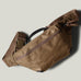 Brown waist cross body bag with technical fabric and brown leather details.