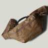 Brown waist cross body bag with technical fabric and brown leather details.