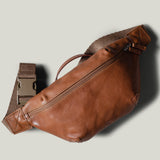 Brown leather waist cross body bag with brown leather details.