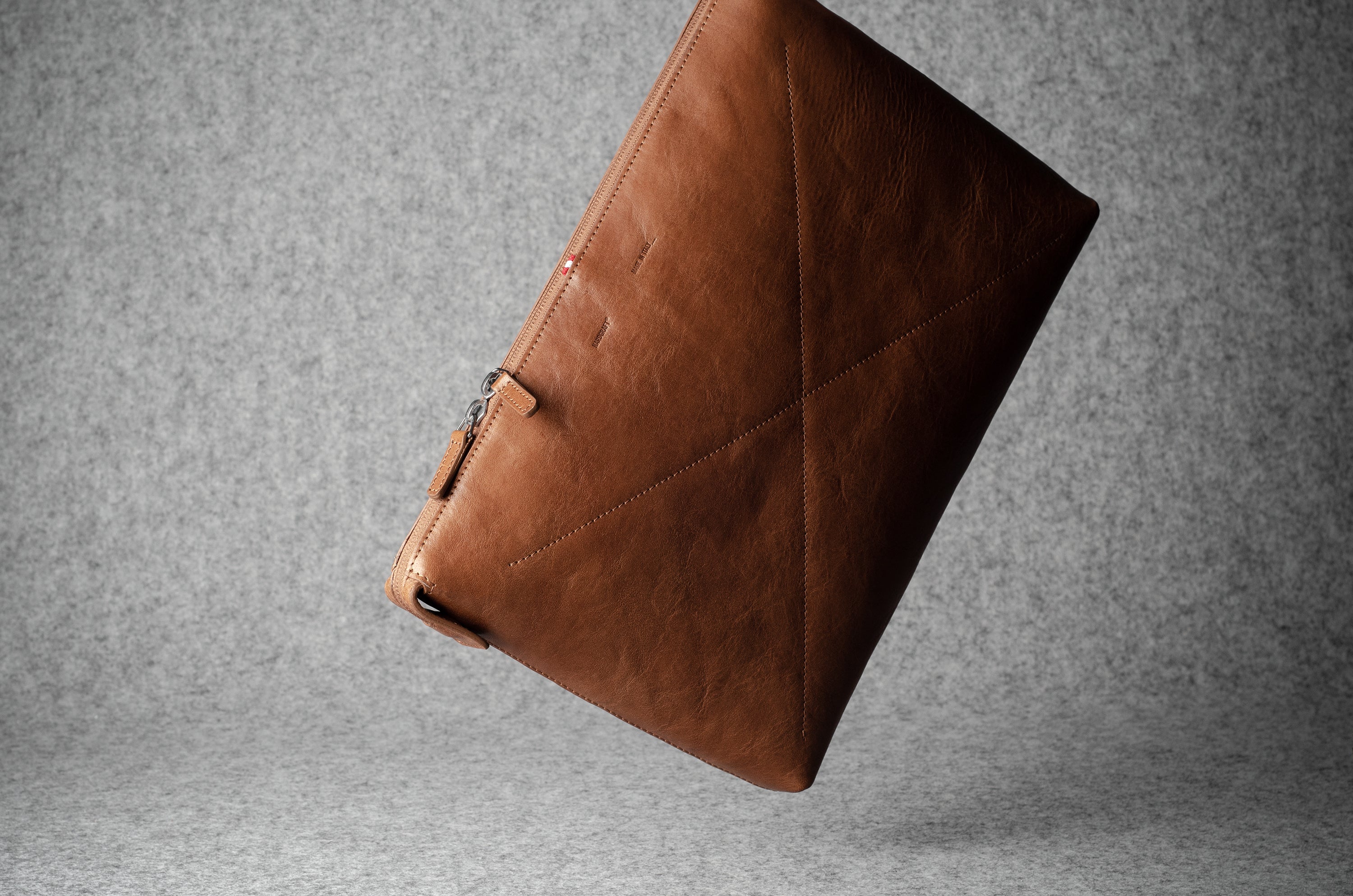 Brown leather laptop case with zip
