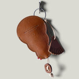 Brown leather keypouch on a light gray background