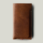 Brown leather phone case on a light gray background
