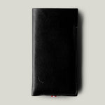 Black leather iphone case on a light gray background