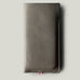 Gray leather phone case on a light gray background