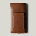 Brown leather  iphone case with brand embossing on a light gray background