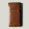 Brown leather  iphone case with brand embossing on a light gray background