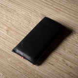 Black iphone case on a wooden surface