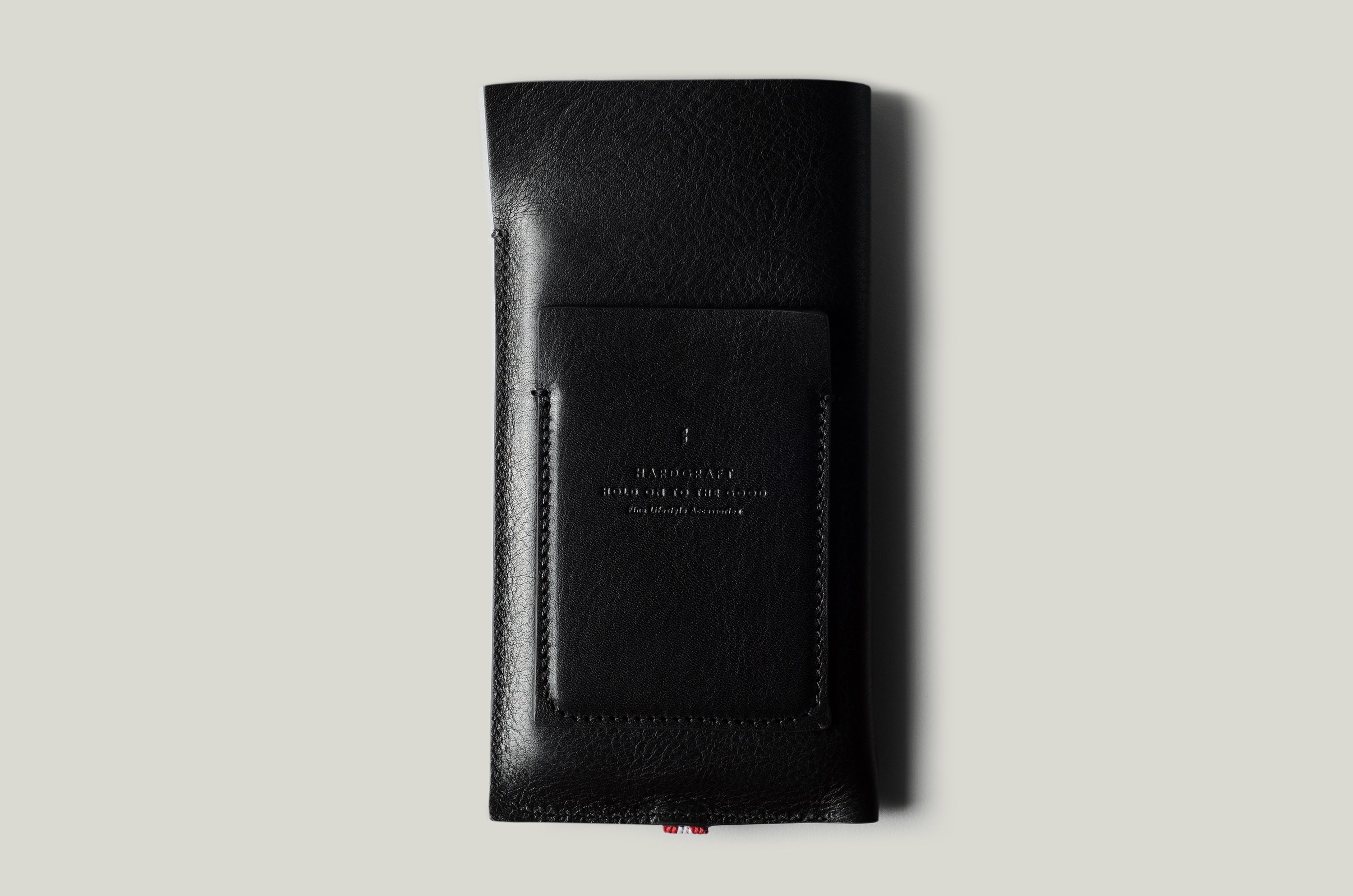 Black leather iphone case on a light gray background