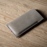 Gray iphone case on a wooden surface