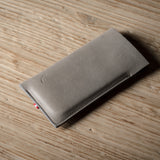 Gray iphone case on a wooden surface