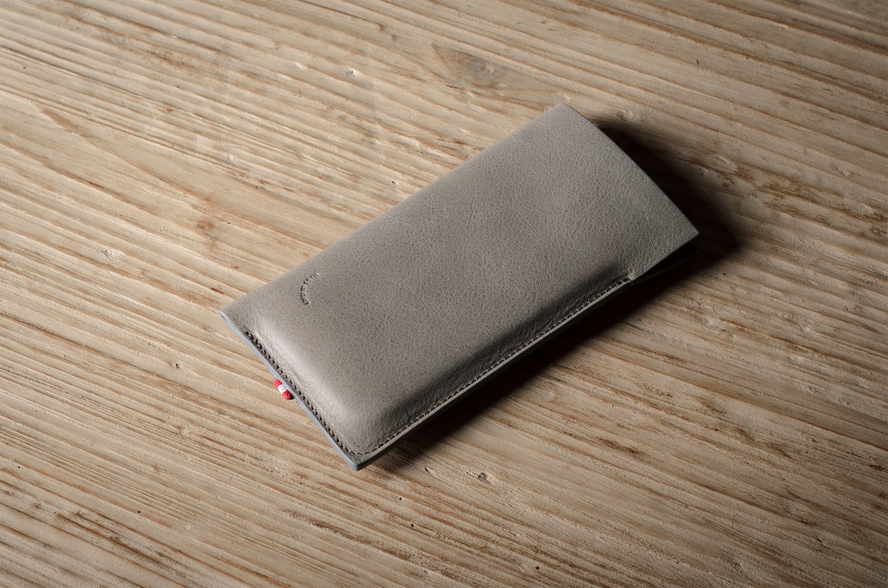 Gray iphone case on a wooden surface