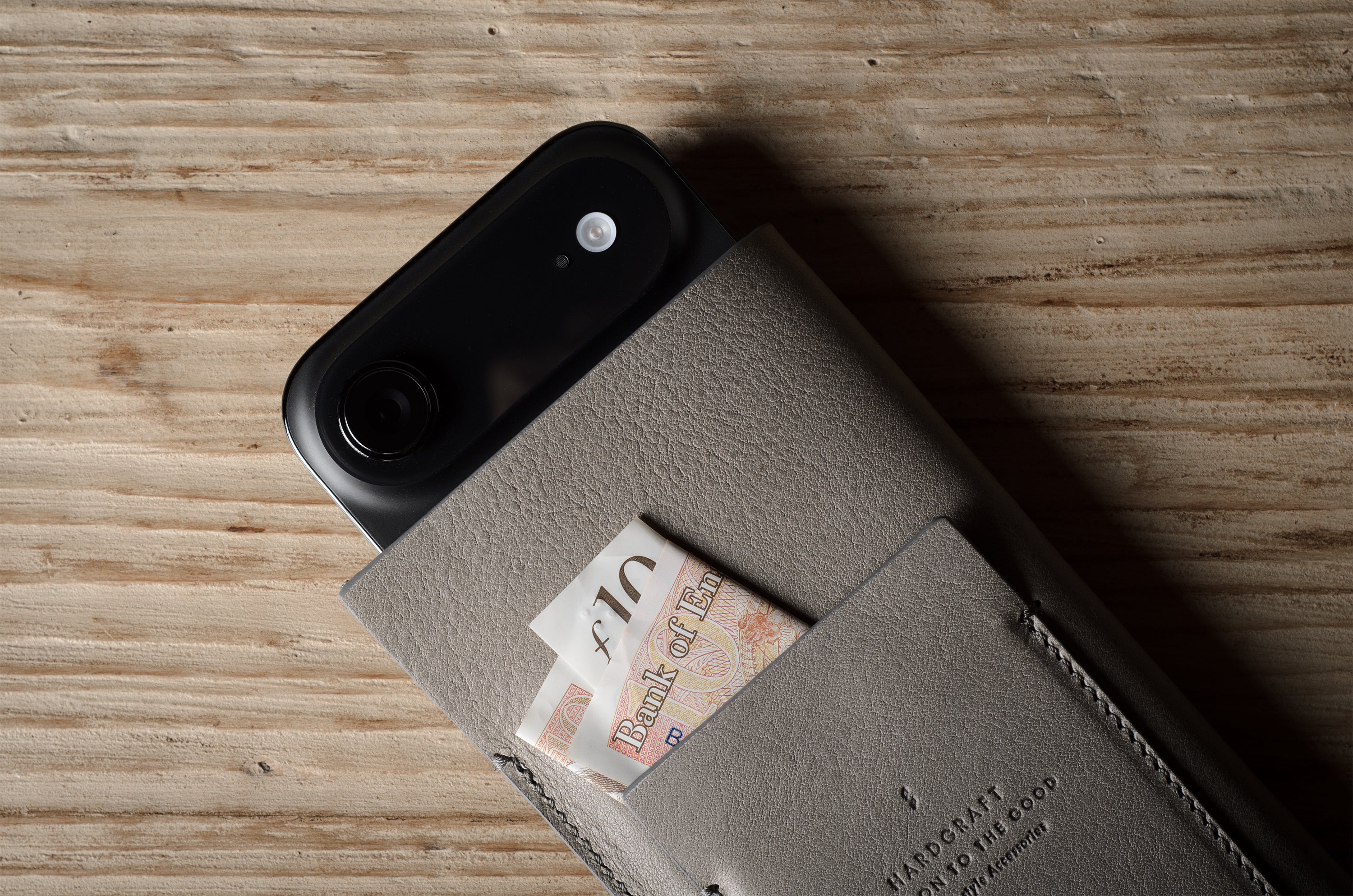 iphone case case with a card pocket on a wooden surface