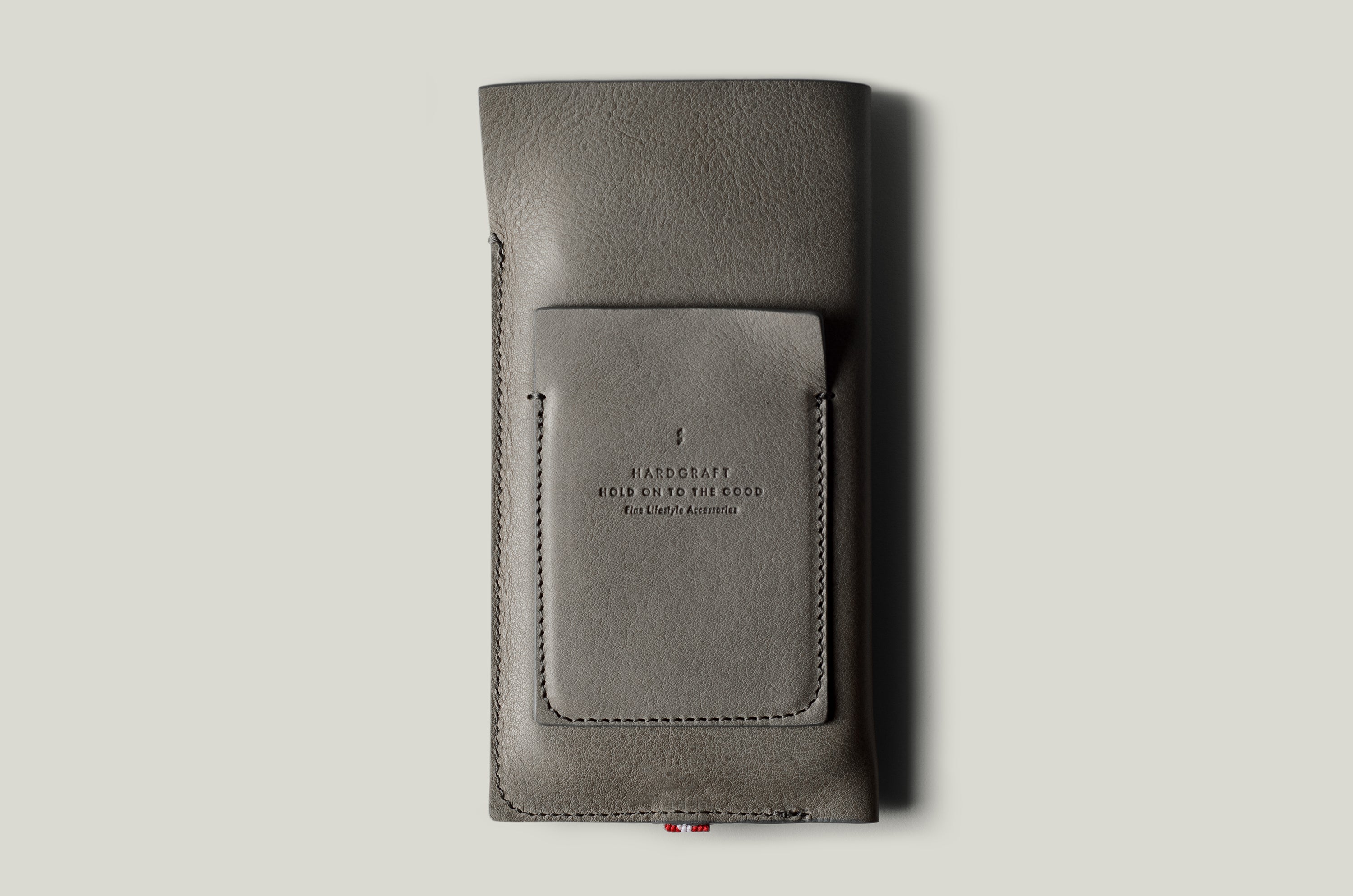 Gray leather iphone case on a light gray background