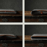 Gray wool felt laptop sleeve with brown leather on a wooden surface