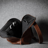 Brown leather bag on a gray background