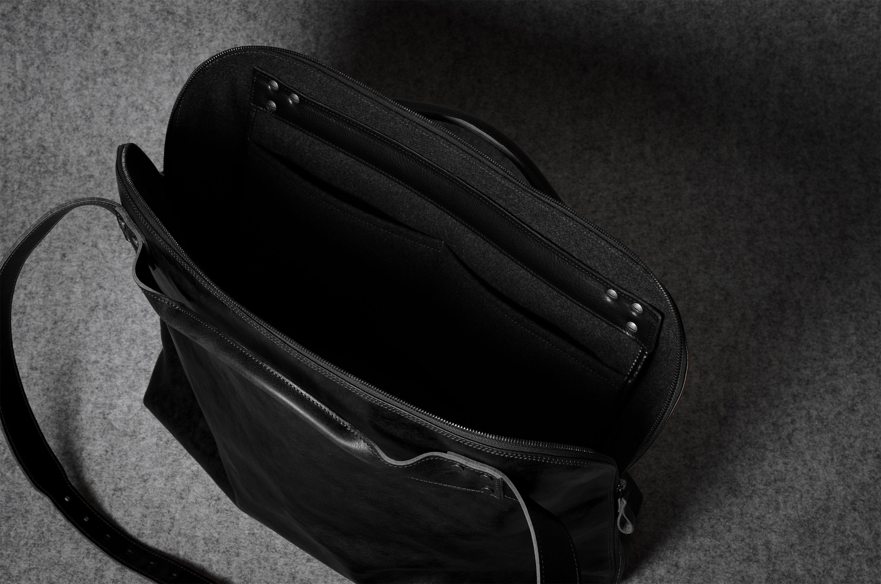 Black bag on a dark textured surface